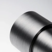 Brushed titanium CNC components with linear grain texture and industrial finish