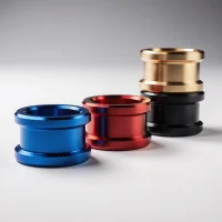 CNC machined aluminum parts with colorful anodized finishes in blue, red, gold, and black