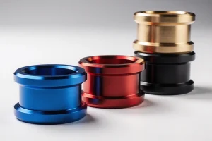 About-Us 13 CNC machined aluminum parts with colorful anodized finishes in blue, red, gold, and black
