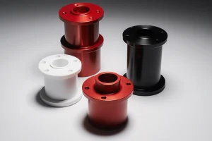 About-Us 14 CNC machined parts with powder-coated surfaces in red, black, and white